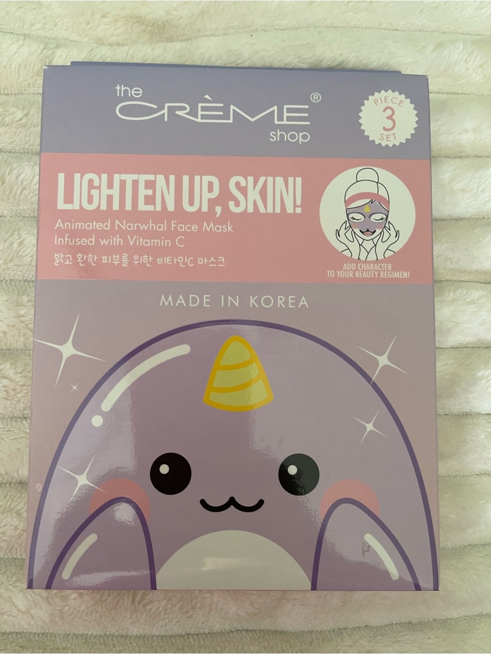 the CRÈME shop Lighten Up, Skin! Animated Narwhal Face Mask - Lavender & Yellow